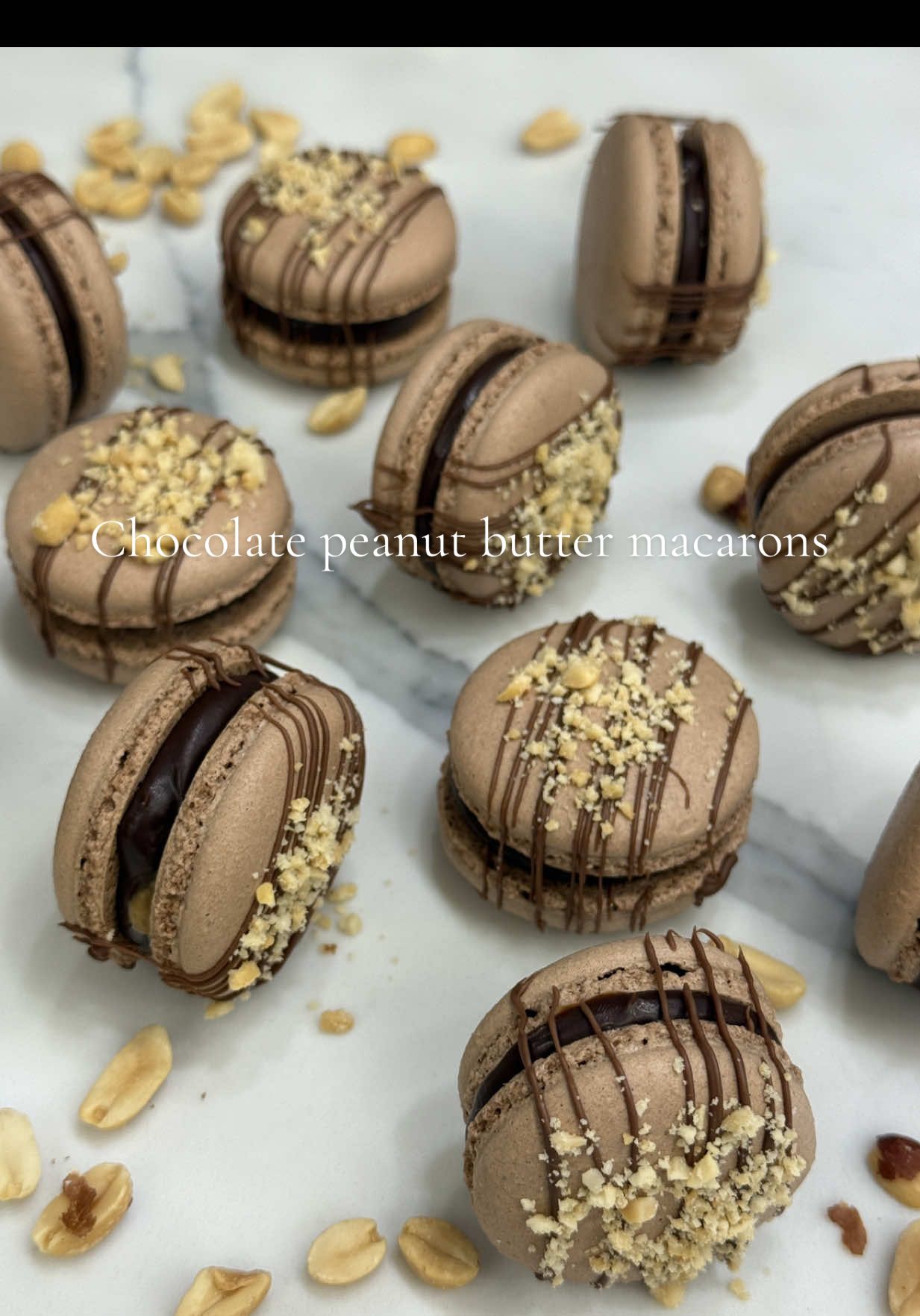Fill and decorate chocolate peanut butter macarons with me😋😋 This is my all time favorite macaron flavor! I love chocolate and peanut butter together, the combo is perfect🩷  Filled with my delicious chocolate ganache and peanut butter, garnished on top with chocolate drizzle and crushed up peanuts😁  I am so grateful for all of you guys, I am so close to 1000 of you all🫶🏻 I will have a special video coming soon when it happens😋😋 #homebakerybusiness #baking #macaronsoftiktok #foryoupage #frenchmacarons 