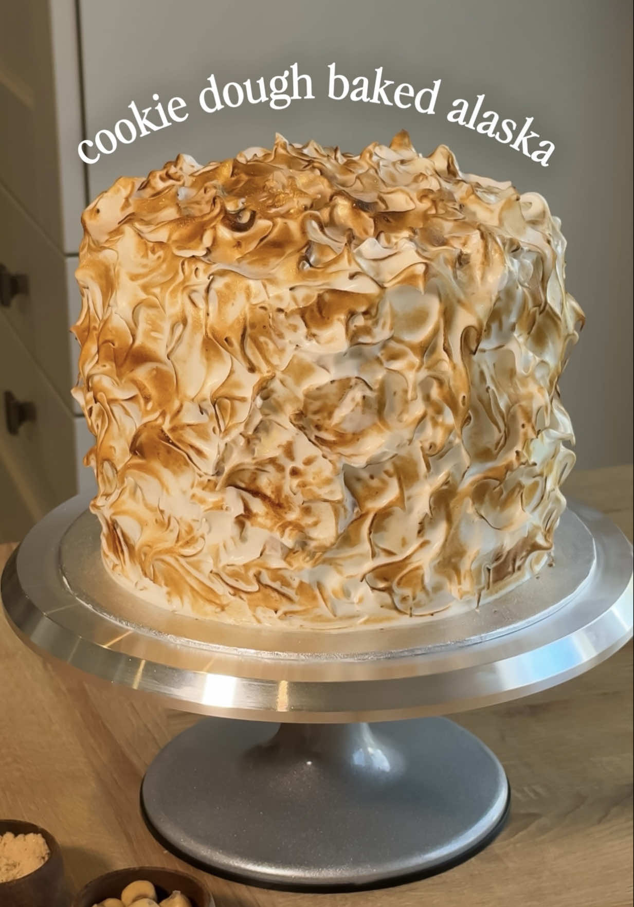 FUDGEY COOKIE DOUGH BAKED ALASKA 🍪 making my own birthday cake is the one tradition I’ll never skip 🎂 chocolate fudge sponge with pockets of homemade cookie dough, soaked in vanilla-espresso syrup & layered between cookie dough swiss meringue buttercream for the outside, I swapped buttercream for toasted Italian meringue (best hack if you want a dramatic but effortless finish)✨ #birthdaycake #cookiedoughcake #bakedalaska #homemadecake #bakingtiktok 