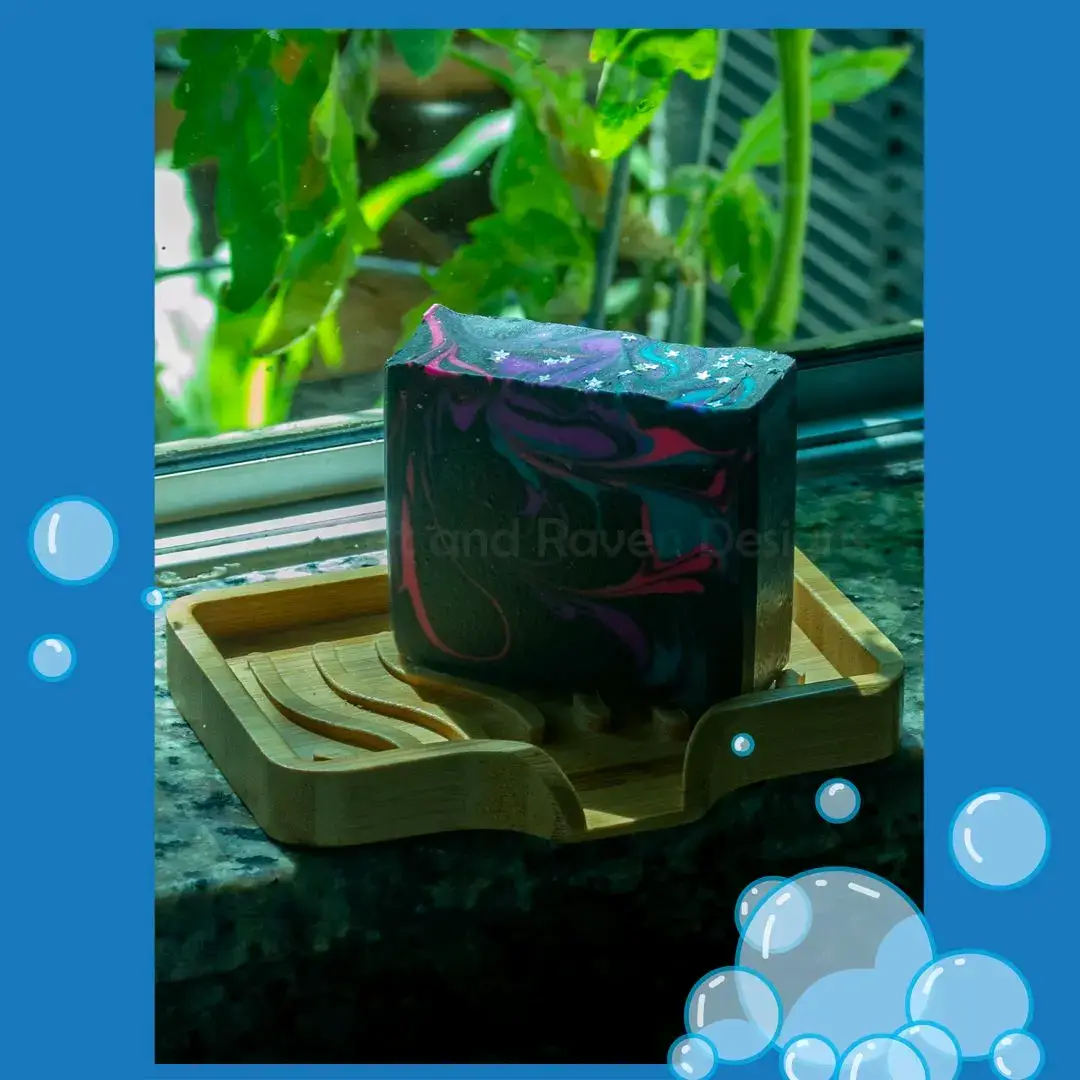 Lilac and gooseberry your jam? Then Big Bang is the bar soap for you! Inspired by Yennefer of Vengerberg's perfume, this is one of our best sellers. If you haven't tried it out yet, it's a great time to do so 👀  https://catandravendesigns.com/products/big-bang-soap  . . . #handmadesoap #artisansoap #lgbtownedbusiness #bestseller #barsoap