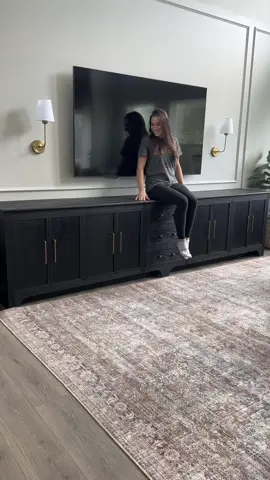 You know you’re an adult when you’re excited about hiding clutter 🤣🤣  No but seriously this big boy is 10ft long. We still have room for more toys (just don’t tell my kids that).  I saw a picture from @peachandpineinteriors and knew instantly that was the console I wanted to build. She is super talented so go check out her page! and the inspo pic was built by @brokencompasswoodworking who is a super talented woodworker! Here are all the supplies I used 👇🏻 - @realmilkpaintco in Arabian night and their wood wax for the finish  - 3 sheets of 3/4” red oak plywood - 1 sheet of 3/4” birch plywood (for the inside cabinet)  - 1x3 red oak boards (3) - 1x6 red oak boards (3)  - Knobs and handles from @amazonhome  - Inset door hinges from @rockler_woodworking  The build is saved under “media console” in my highlights.  Like & follow for more DIY furniture builds.  Now that this piece has completely transformed my living room it’s time for my next project, a coffee table!  #mediaconsole #diyfurniture #consoletable #consolestyling #buildlikeagirl  