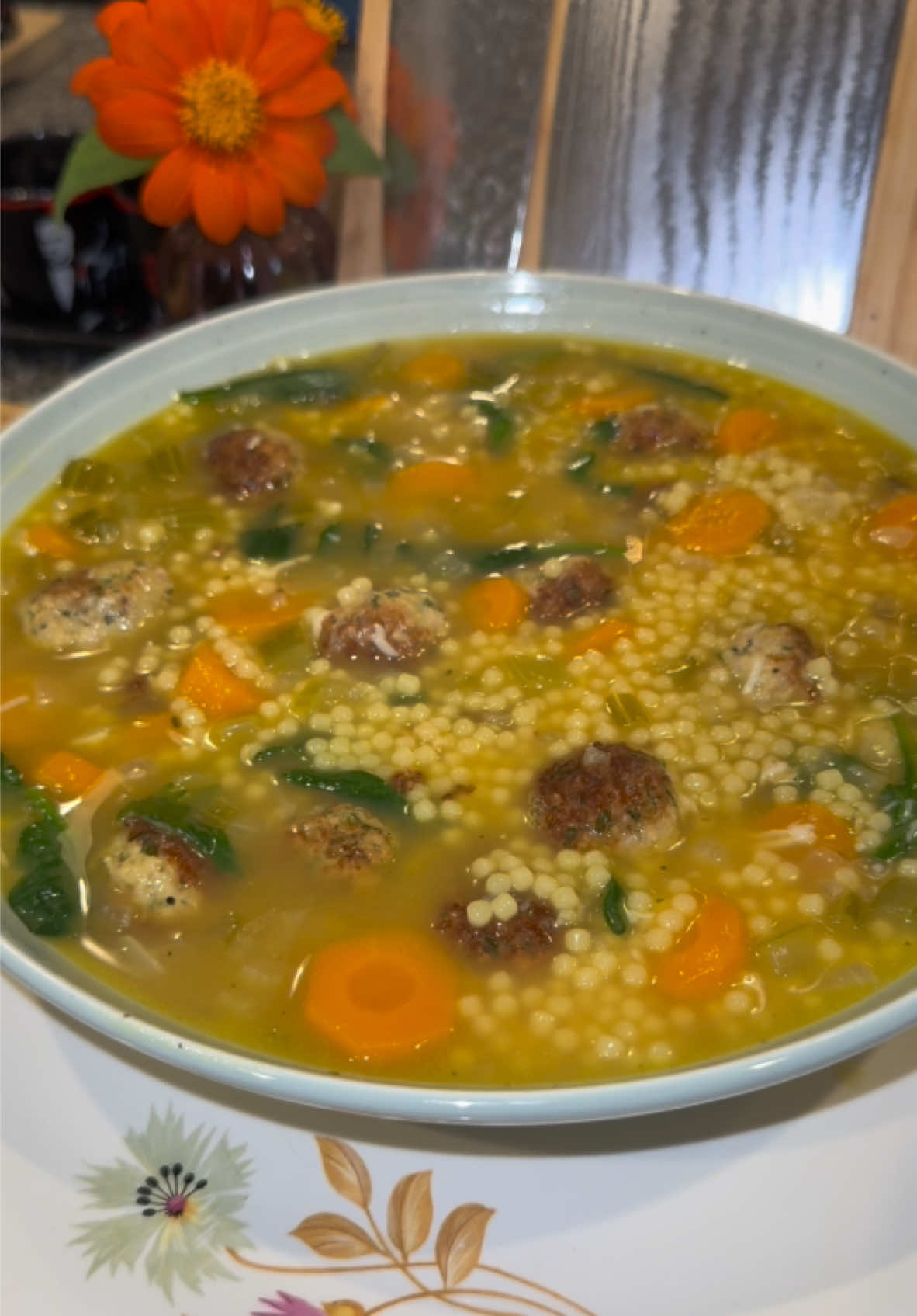 Chicken Noodle Italian Wedding Soup🍲♥️ For the chicken meatballs, in a large mixing bowl add: -1/2 cup of Italian seasoned breadcrumbs  -1/3 cup of heavy whipping cream  -2 whisked eggs  Whisk this together then add: -1 cup of grated Parmesan  -1/3 cup of finely diced onion  -1/3 cup of finely chopped parsley  -1 tablespoon (of each, finely chopped) fresh oregano, thyme, and rosemary -8 cloves of minced garlic  -chicken bouillon powder -black pepper Mix this together, then lightly fold in 1 pound of ground chicken (make sure it’s not lean ground chicken.) Lightly mix this together, then roll up 1 tablespoon worth of the mixture into meatballs.  Brown them in a pot on medium heat with oil and set them aside.  In the same pot add: -2 tablespoons of butter  -2 cups of diced onions  -1 cup of diced celery  -1 cup of sliced carrots  -4 cloves of minced garlic  Cook until the onions are soft then add: -1/2 cup of dry white wine  -10 cups of chicken bone broth or stock -chicken bouillon (I use both better than bouillon and chicken bouillon powder.) Turn the heat up to medium high, and once it comes to a boil add: -1 cup of Acini de Pepe (you can also use Pastina, it’s basically the same thing just a different shape) -all of your meatballs  Once the pasta is cooked, turn the heat off and let the soup cool down a little.  Then before serving, add in: -about 4 cups of fresh baby spinach  -fresh Italian parsley  Enjoy💜  #soup #chickennoodlesoup #italianweddingsoup #Recipe #recipes #food 
