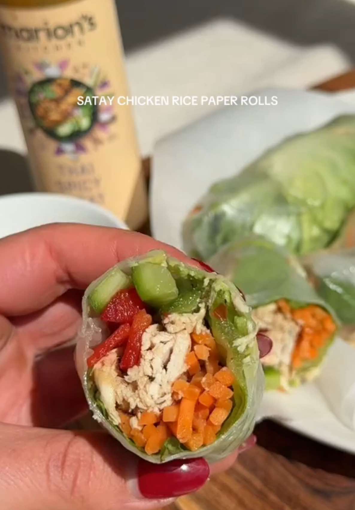 The warm weather on the Gold Coast this week has me leaning towards fresh lunch options, including these easy high protein chicken rice paper rolls 🤤  Ingredients: 6 x Valcom rice paper sheets 300g chicken breast, boiled + shredded 120g Avo, sliced Cucumber, sliced Carrot, shredded Capsicumn, sliced Cos Lettuce  Each roll is roughly 130 calories with 12g of protein. I meal prepped these into serves of 3 rolls, each serve being 390 cals and 36g protein (without sauce). I have also come to find my new favourite sauce - Marions Thai spicy satay sauce, which I also paired with Ayam light chilli sauce when dishing up lunches!  With 30ml of each sauce the meal ends up being 440 calories with 37.5g protein 🙌🏼 #nutrition #healthyrecipe #protein #mealprep #fresh