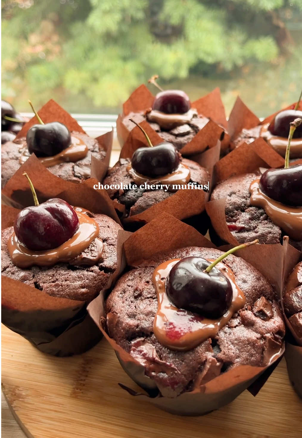 Chocolate Cherry Muffins 🍫🍒 Rich chocolate muffins filled with homemade cherry compote, chunks of melty chocolate, and sealed with a layer of glossy melted chocolate on top. Bakery-style muffins that taste like Black Forest cake in muffin form 🤎 (Full recipe on my blog or YouTube – link in bio) 🫶 #chocolate #muffins #baking #Recipe #baketok 