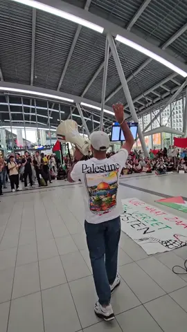 A sit-in protest held at Utrecht central station in support of Gaza.