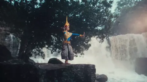 The story of Moni Mekhala, a goddess who uses a magical crystal ball to fight a demon and create lightning, is often depicted in the Robam Moni Mekhala (Mekhala Dance) is a traditional Cambodia dance. The yaksha (or ogre) wears a mask and costume with a 