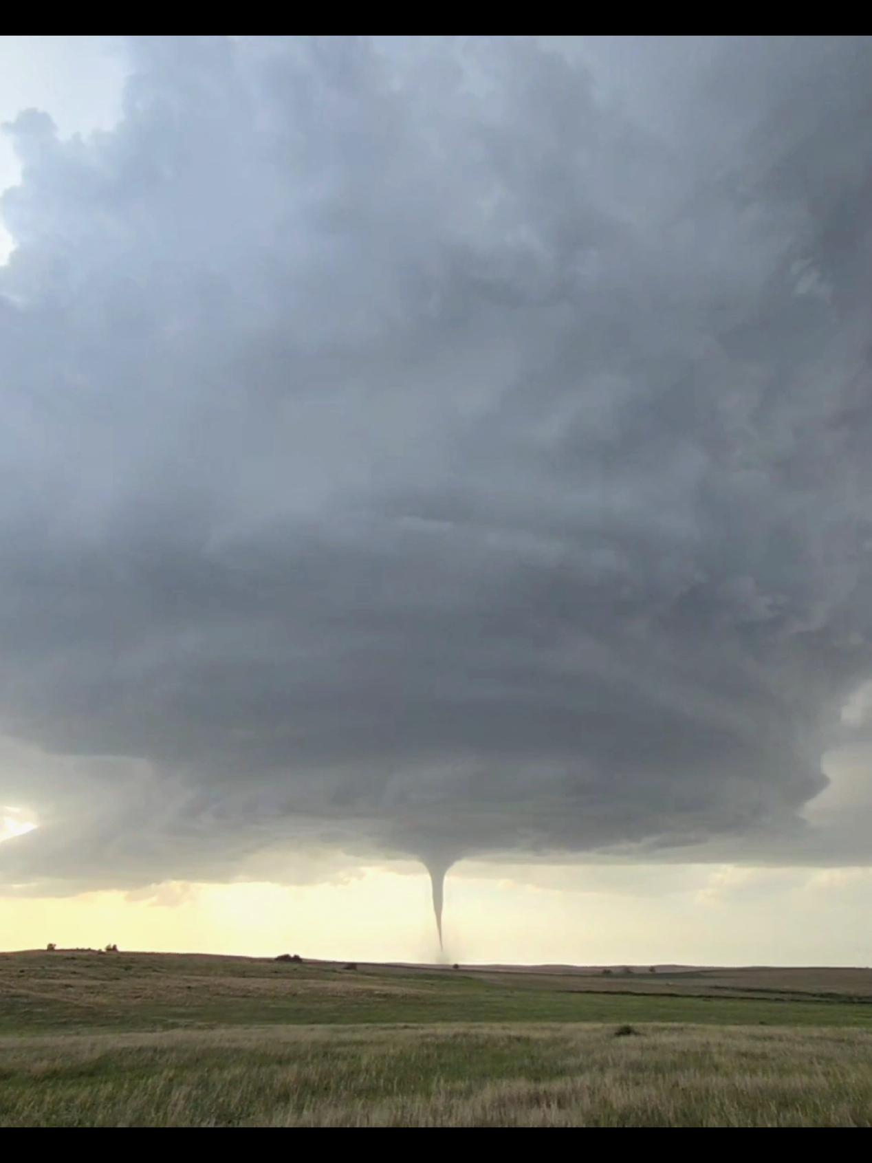 One of the GREATEST MOMENTS OF MY LIFE! Real-time Reaction and video as the Tornado was in progress below immaculate storm structure! Ill never forget these moments the rest of my life! #tornado #stormchaser  #supercell  #foryou  #nebraska @The Weather Channel @FOX Weather @National Geographic @AccuWeather @Nikon USA @Discovery @Reed Timmer, PhD 