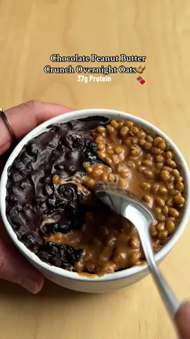The best combo EVER in oat form 🫡🫡 ✨recipe✨ 50g oats 5g chia seeds 30g protein powder  50g of yoghurt  170mls of water (or milk) For the top: 15g of peanut butter (I use runny peanut butter and mix with melted butter to thin) 10g cocoa powder + 20g water to thin (and honey) 10g soy crisps Calories are shown in @Fitia - Smart Nutrition App, you can use code JULES to get 10% off premium! 1. Cook the oats with the chia seeds, then mix in yoghurt and protein powder  2. Mix 5g of the soy crisps with the peanut butter and spread over half of the oats. Make the chocolate ganache, mix in the remaining 5g of soy crisps, and spread on the other half. 3. Swirl both sides together, then refrigerate overnight!  #oattok #healthybreakfast #proteinbreakfast #overnightoats #proteinoats 