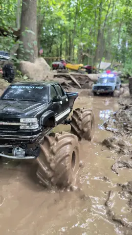 Nasty Chevy Silverado mud truck with monster truck tires pulls out a jeep cherokee #r#rctrucksh#hobbym#muddingf#foryoupage