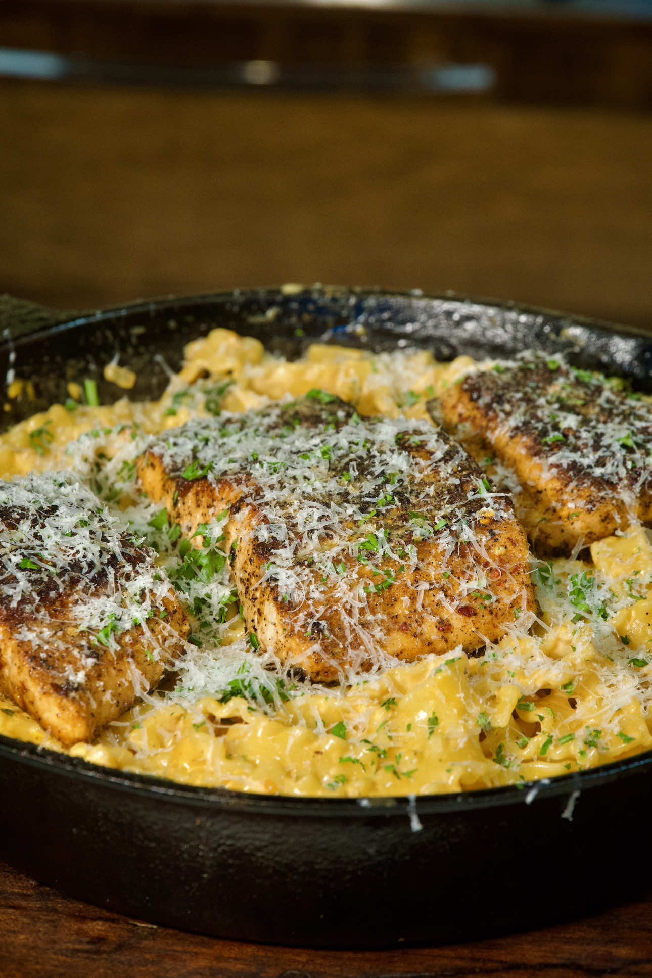 Creamy Cajun Salmon Pasta  For the Salmon -  1 1/2 Lb Salmon Fillet (skin on or off, your choice) 2 tbsp olive oil 1 Tsp Red Chili Flakes (Optional) 2 1/2 Tsp Onion Powder 1 Tsp Lemon Pepper 1 Tsp Chili Powder 2 1/2 Tsp Cajun Seasoning  1 Tbsp Olive Oil  2 Tbsp Salted Butter(Baste) ———————————- Sauce  Pinch of Salt 1/4 Cup Fresh Basil, roughly torn 1 Tsp Onion Powder  1/2 Tsp Red Chili Flakes 2 Tsp Cajun Seasoning  1 Cup Dried Sun Tomatoes, chopped 2 Cup Fresh Spinach  2 Tsp Tomato Paste  1/2 Medium white Onion, diced 4 Cloves Garlic, minced 1 1/2 Pint Heavy Cream  1 Cup Grated Parmesan (plus extra for serving) 16 oz Cooked Mafaldine Pasta (Al Dente according to Package) ———————— https://www.thatsavagekitchen.recipes/recipes/creamy-cajun-tomato-salmon-pasta —————————— #thatsavagekitchen #seafood #salmon #pasta #seafoodlover           