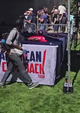 After Charlie Kirk was escorted out of the Utah event, the scene turned chaotic. One man strolled up to the restricted area and began taking hats, and soon others were asking him to grab some for them too. What started as a tense moment quickly spiralled into a bizarre spectacle that left law enforcement and security visibly furious. #CharlieKirk #Utah #MAGAHats #DonaldTrump #USA 