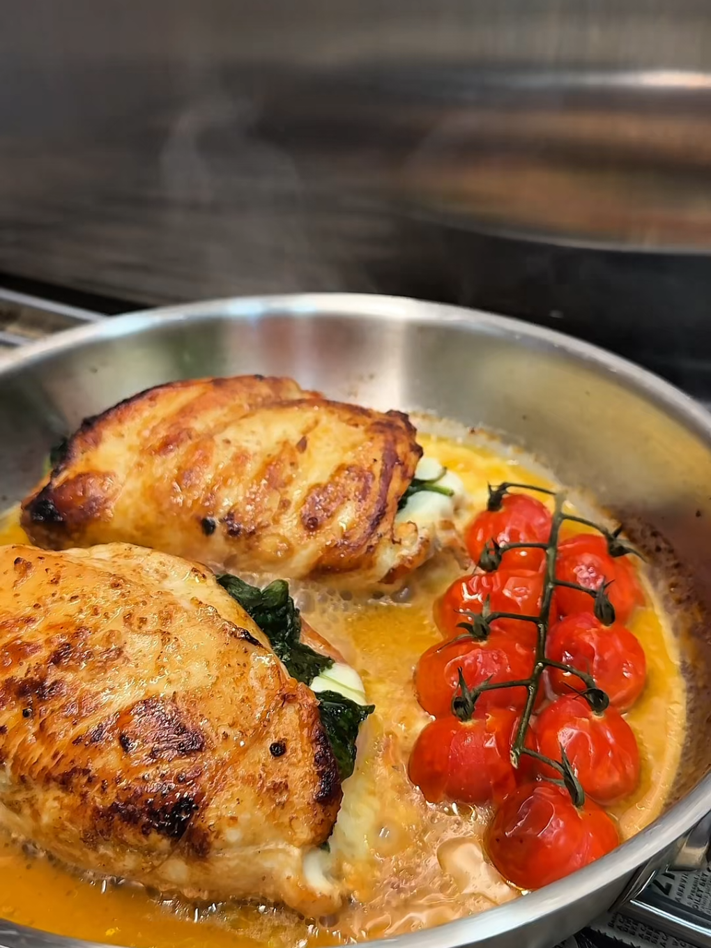 Stuffed Chicken Breast Recipe
 Ingredients:
 • 2 boneless chicken breasts
 • 1 tomato, thinly sliced
 • 4 slices fresh mozzarella (or regular mozzarella)
 • 10-15 fresh spinach leaves
 • 1 tsp dried oregano
 • Salt and pepper, to taste
 • 2 tsp olive oil
 Instructions:
 1) Preheat oven to 400°F (200°C).
 2) Prepare chicken: Slice each chicken breast
 horizontally to create a pocket, starting at the
 thickest part. Don’t cut all the way through.
 Season with salt, pepper, and oregano.
 3) Stuff chicken: Place 2 tomato slices, 2
 mozzarella slices, and a few spinach leaves in
 each pocket. Secure with 4 toothpicks diagonally.
 4) Sear: Heat 2 tsp olive oil in a pan over medium-
 high heat. Sear chicken for 2 minutes per side,
 flipping carefully.
 5) Bake: Transfer chicken to a casserole dish (or
 use the pan if oven-safe). Bake for 15 minutes or
 until the chicken is cooked through (no longer
 pink, juices run clear).
 6) Serve: Remove toothpicks and enjoy!
 Tip: To keep chicken moist, season well, sear until
 golden, and bake just until done. Avoid
 overcooking to prevent drying out. #sofiaafoodie #chickenrecipe #foodrecipe #delisious 