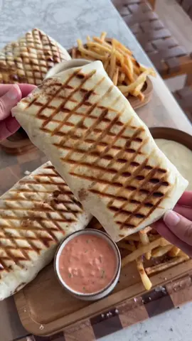 🌯🍟 Meet the French Taco: stuffed with juicy chicken, crispy fries, and smothered in creamy cheese sauce, then panini-pressed until golden and toasty. Every bite is gooey, crunchy, and absolutely irresistible 🤤  Recipe is up on the blog — www.moribyan.com — or head to the link in bio! 🤎