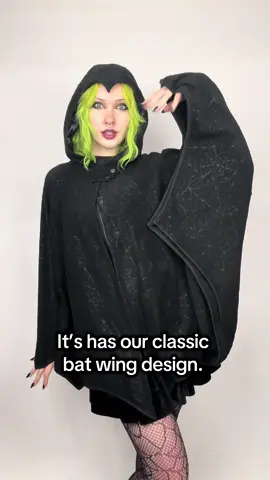 Get caught in the web of our newest batwing cape! With its embossed details, finger loops and phone pocket, it’s perfect for ghouls who like to make an entrance.  🕸️🦇🖤 #kreepsville #batcape #gothstyle #spookyseason #darkfashion       