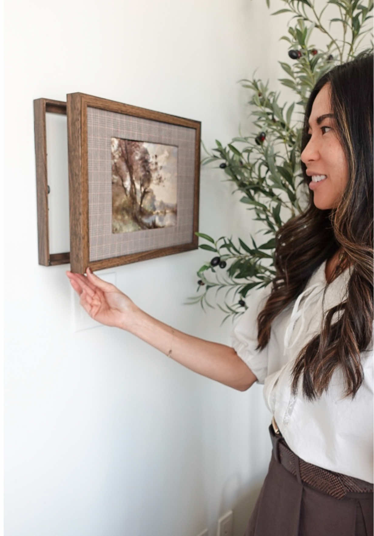 My thermostat just got promoted to wall art 🖼️🙌🏼. I love this easy DIY for hiding those little eyesores around the home.  All you need are two @IKEA Rödalm picture frames, a couple of hinges, and magnets to keep the frames closed. I used @Command Brand strips to hang mine—so simple! Would you try this DIY? #ikeahack #diypictureframe #torontolife #torontocreator #diypictureframehack      