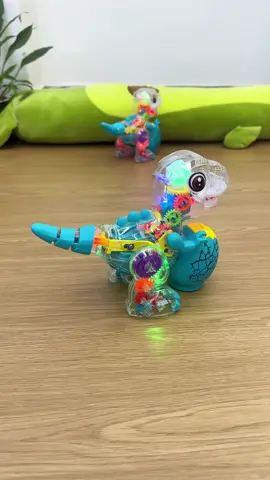 Nhà có rất nhiều đồ chơi, và bé rất thích chú khủng long này. Nó có đèn và nhạc riêng, và bạn có thể thấy các bánh răng bên trong đang chuyển động #fyp #quatrungthu #dochoichobe #xuhuong 
