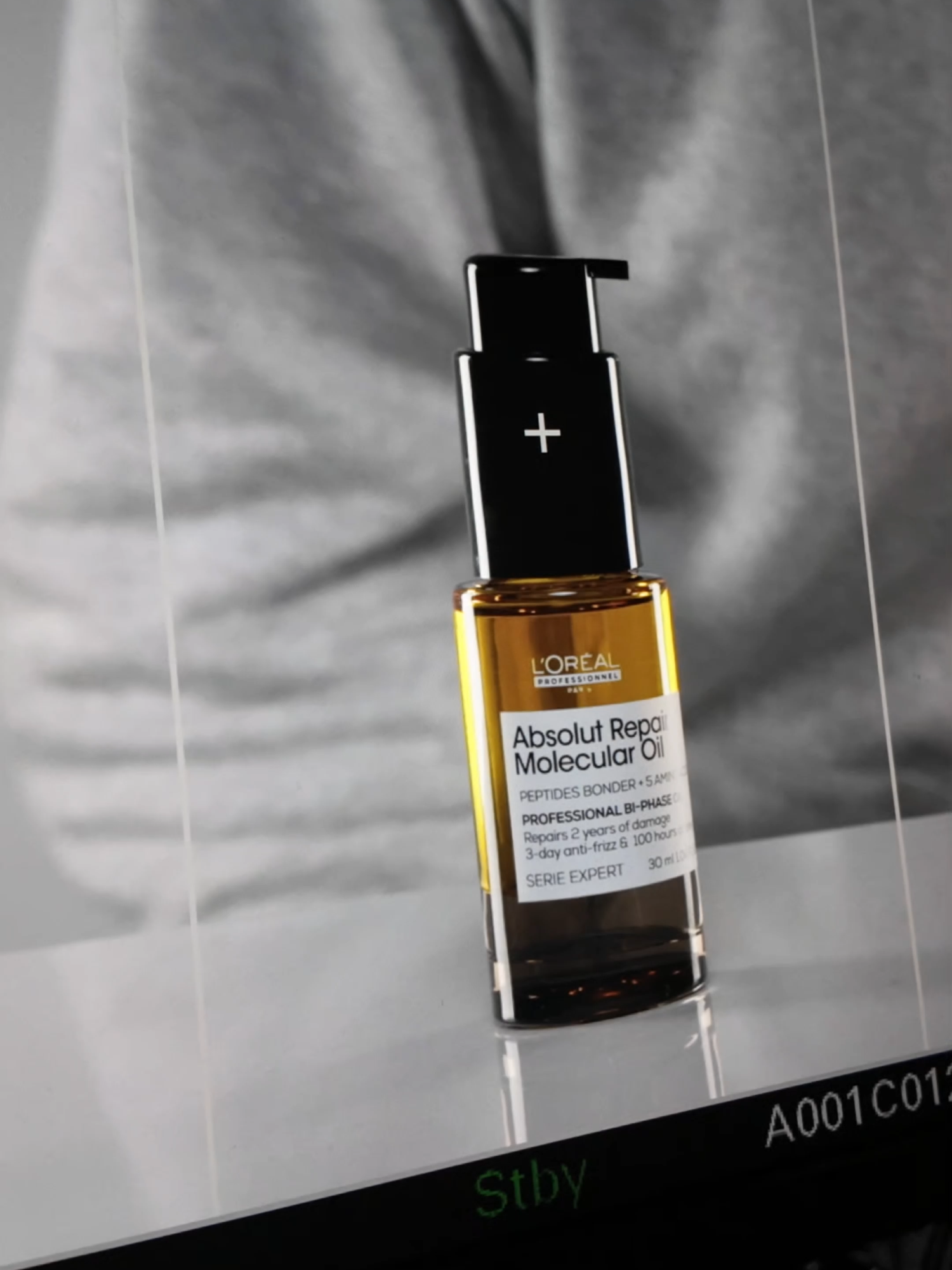 Behind the scene of the Absolut Repair Molecular Bi-phase Oil photoshoot. ✨ #behindthescene #hairtok #AbsolutRepairMolecular #hairoil