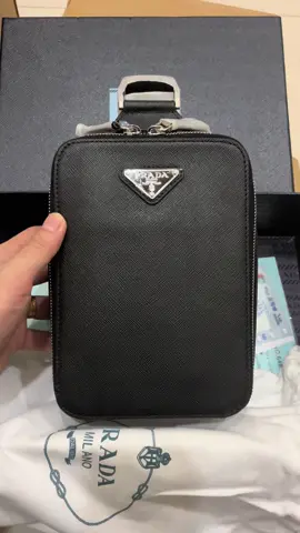 Minimalist luxury for everyday carry 🖤   The Prada crossbody that redefines sleek style.  #PradaBag #SaffianoStyle #LuxuryEssentials   #MensFashionUK #DesignerCrossbody@Vipbag 