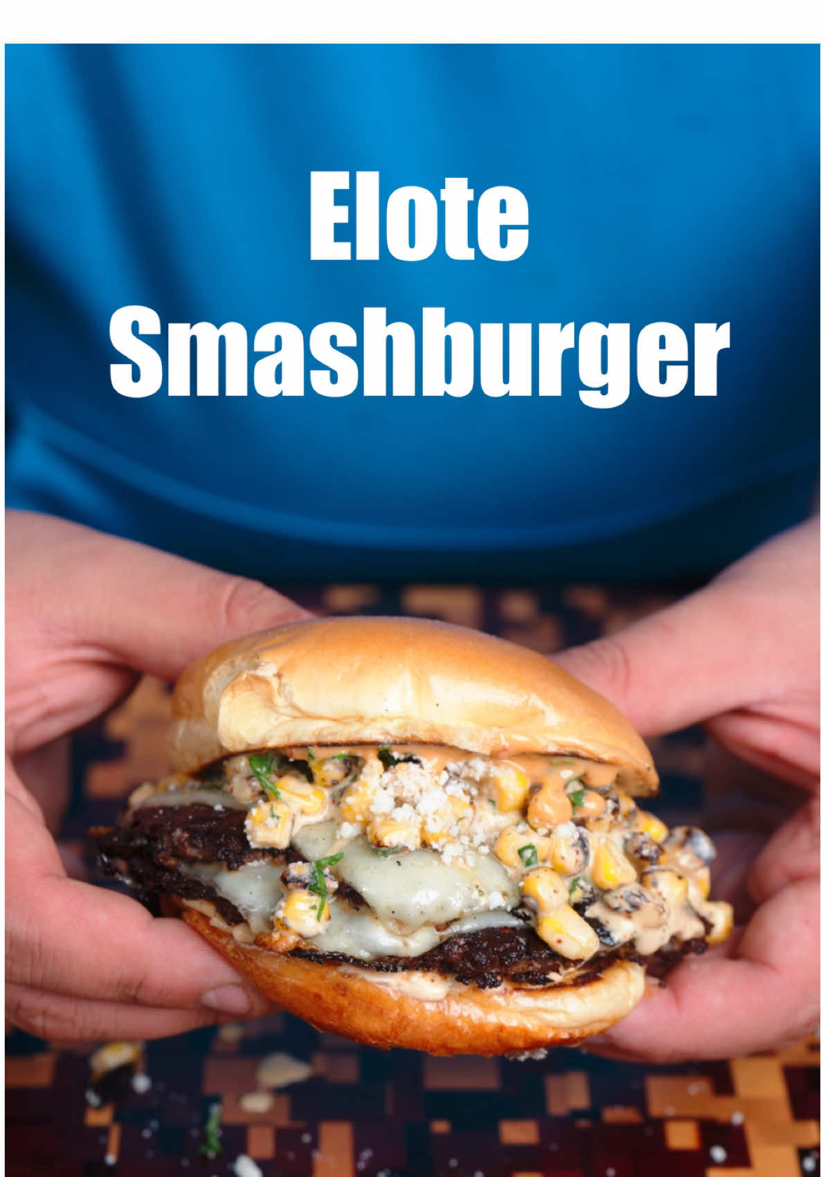 This Elote Style Smashburger was insane!! My Jalapeno Smashburger Patties cooked on the @recteq SmokeStone, topped off with esquites, and packed with flavor!  Esquites: • 2.5 - 3 cups roasted corn • 1/3 cup mayo @eatayoh  • juice from 2-3 limes • 1/4 cup fresh cilantro • 2-3 oz cotija cheese • Everything but Elote seasoning from Trader Joe’s  • salt to taste  Burger: • 3-4 oz balls of 75/25 beef • thinly sliced jalapeños • havarti cheese • toasted brioche buns • Elote cream cheese spread • cilantro & cotija cheese • Hatch Chile sauce 1. Start by combining all the above ingredients for the esquites in a large bowl. I usually start with only adding the juice from 1 lime and add more at the end to taste. Season with salt and adjust to your preference. Set in the fridge to develop for atleast an hour.  2. Fire up the Recteq SmokeStone to medium hi heat, then form the beef balls and slice the jalapeños. Use a mandolin if you have one!  3. Place each beef ball down and top with sliced jalapeños before smashing hard into the cooktop.  Then season with your favorite burger seasoning before letting them cook for about 90 seconds.  4. Carefully scrape the burger free before flipping over, then top with Havarti Cheese and let that steam and melt for a few seconds. Once melted, remove the Pattie’s and build the burger!  5. Start with a toasted bun, the the Elote spread or hatch chile sauce, two Pattie’s with cheese, a few spoonfuls of esquites, and then top that off with some fresh cilantro and cotija cheese before place down the top bun!  #burger #smashburger #Recipe #elote  #cornsalad