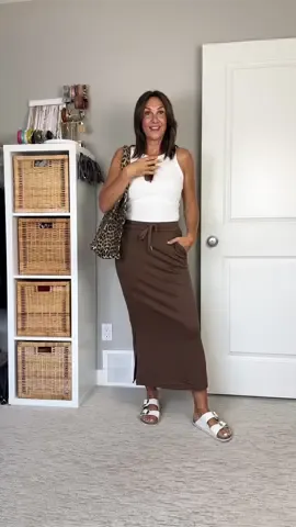 Trying to dress for fall when it's hot! Did you know wearing glasses on your head is considered a fashion mistake? I heard it on @SheerLuxe and those women know what's up. Links are on my LTK (🇨🇦 link for the skirt is on my Amazon storefront) - tank: Uniqlo - skirt, sun glasses: Amazon - sandals: Birkenstock - bag: Ganni Fall transition outfit, fashion mistake, early fall outfit, pencil skirt outfit, leopard bag outfit 