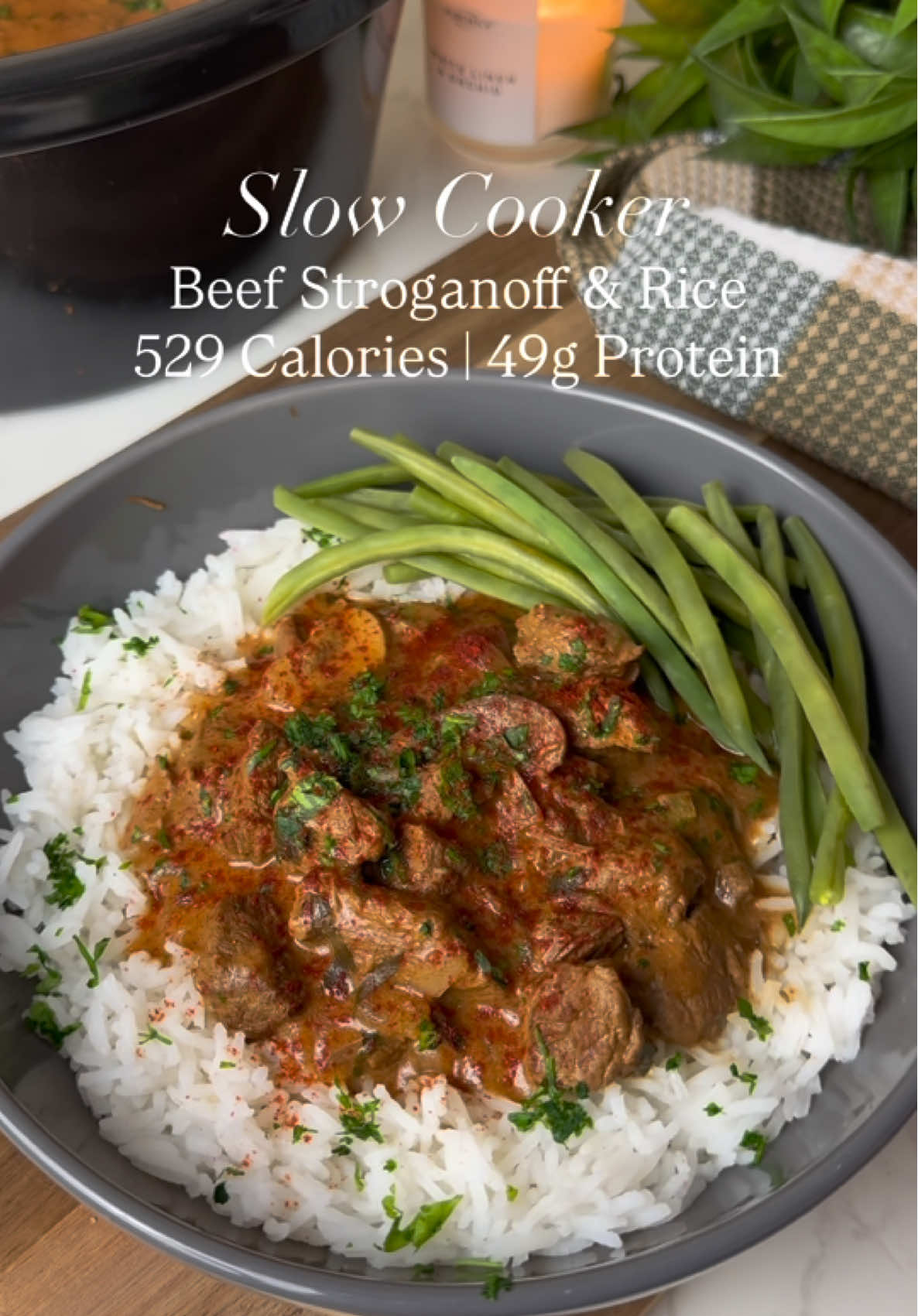 Recipe in caption ⬇️ Slow Cooker Beef Stroganoff   Rich, creamy, and packed with flavour, this high-protein slow cooker beef stroganoff is served with fluffy rice and steamed fine beans, garnished with fresh parsley and a light dusting of paprika. Nutrition ⬇️ Per serving, entire meal.  Calories- 529, Fat - 9.3g, S/Fat - 3.7g, Carbs - 67.3g, Sugar - 8.3g, Protein - 49g Ingredients ⬇️ Serves 4  700g Lean Diced Beef  1x Onions, Diced  4x Garlic Cloves, Minced  200g Chestnut Mushrooms, Sliced  2x Tap Smoked Paprika 1x Tsp Thyme, Dried 2x Tsp Parsley, Dried 2x Tbsp Dijon Mustard  2x Tbsp Tomato Puree 1x Tbsp Balsamic Vinegar 2x Tbsp Worcestershire Sauce  1x Tbsp Light Soy Sauce 150ml 400ml Beef Stock  1x Tbsp Cornflour 2x Tbsp Reduced Fat Crème Fraîche or Soured Cream  Parsley, Chopped  To serve -  250g Rice, Dried 180g Trimmed Fine Beans  Method ⬇️ Season the beef with black pepper. Heat a non-stick pan and brown the beef for a couple of minutes. Transfer to the slow cooker. Add the onion, garlic, and mushrooms to the slow cooker.  In a jug, whisk together smoked paprika, thyme, dried parsley, Dijon mustard, tomato puree, balsamic vinegar, Worcestershire sauce, soy sauce, and beef stock. Pour over the beef and stir to combine. Cover and cook on low for 7–8 hours or high for 4–5 hours, until the beef is tender. Mix the cornflour with 2 tbsp cold water to form a slurry. Stir into the slow cooker and cook for another 10–15 minutes to thicken. If your slow cooker pan is compatible, you can transfer to the hob and simmer for a few minutes.  Just before serving, stir through the reduced fat crème fraîche or soured cream until silky. Cook the rice according to packet instructions and steam the green beans until tender. Serve the stroganoff over rice with green beans on the side. Garnish with fresh parsley and a light dusting of paprika. Enjoy!  #SlowCookerRecipes #HomeCooking #EasyDinners #OnePotMeals #ComfortFood            