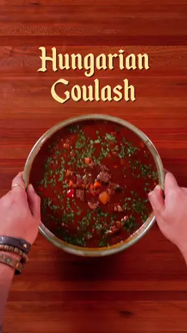 Hungarian Goulash | Soups So Good It Can Cure Any Sickness Ep. 13 INGREDIENTS: Hungarian Goulash - 1 kg beef chuck, cut into cubes  - 1 white onion, diced  - 9-12 garlic cloves, minced  - 1/3 cup of paprika  - 1 tbsp of caraway seeds - 2 green bell peppers, chopped  - 1 red bell pepper, chopped  - 1 cup tomatoes, chopped  - Beef stock to fill the pot  - 1 potato, chopped  - 1 carrot, chopped  - Salt and pepper to taste - Oil/lard for frying  INSTRUCTIONS: - Start by seasoning your meat with salt and pepper and slice into bite sized cubes.  - In a hot soup pot sauté your garlic and onions until softened. Add your meat and season with paprika and caraway seeds. Mix until everything is combined.  - Add your chopped bell peppers along with tomatoes and mix.  - Add beef stock until the pot is filled and allow to simmer for 1-1.5 hrs minutes or until meat is tender before adding the rest of your vegetables. Season with salt and pepper. - Serve with chopped parsley and enjoy!  #Soups #asmr #ASMRCooking 