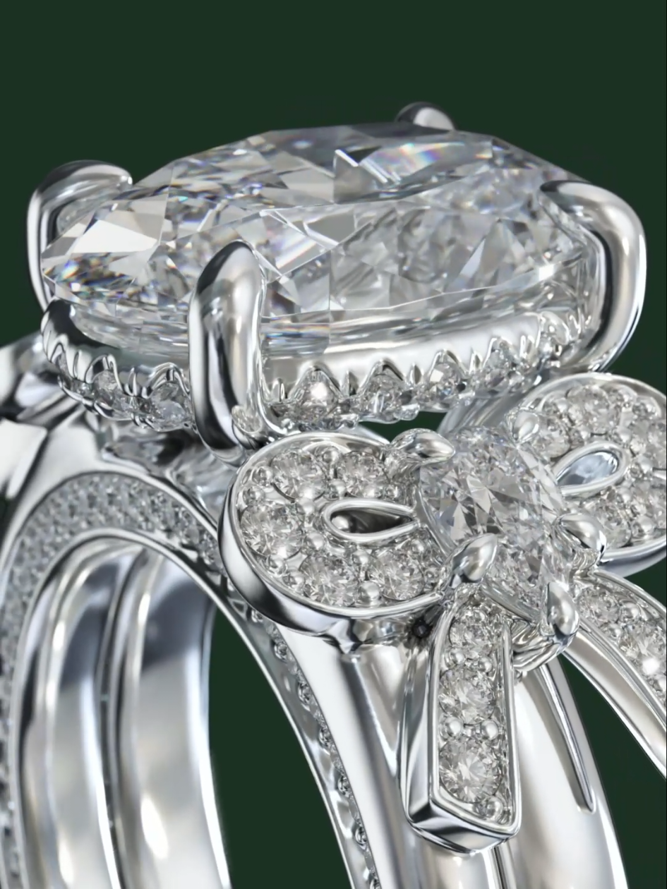 A daydream brought to life-- a 4 carat oval diamond crowned in brilliance, resting above a bow detail that whispers of promises bound together forever. ✨️ . . . #BestCustomJewelers #custom #trending #dream #fyp 