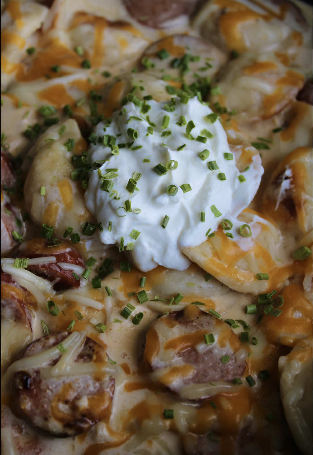 one pan pierogi recipe 🥘🤩     this is such an easy & delicious recipe for the stovetop! definitely a must-try this fall 💗   Ingredients: 2 tablespoons butter or oil 1/2 bag mrs t’s mini pierogies 14 oz Kielbasa for the sauce: 4 oz cream cheese 1/2 cup chicken broth 1/2 cup milk 1/4 cup shredded cheddar cheese Salt, pepper, garlic powder to taste Toppings: 1/2 cup shredded cheddar cheese Sour cream Chives 1. Slice kielbasa into bite sized pieces and set aside. 2. In a large pan, cook pierogies in melted butter or oil on both sides until heated through and crispy. Remove from pan. 3. In the same pan, add in the kielbasa and cook until heated through and crispy on both sides. Remove from pan. 4. Remove pan from heat and let cool for about 2-3 minutes. 5. Over medium high heat combine cream cheese, milk, chicken broth, and 1/4 cup cheddar cheese. Mix until combined and bring to a simmer. Reduce heat to low and cook until sauce begins to thicken - about 3-5 minutes. 6. Add in cooked kielbasa and pierogies. Mix into sauce. 7. Top with 1/2 cup of cheddar cheese. Cover until cheese melts on top. 8. Once the cheese is melted, remove lid and serve. Add any toppings you’d like! #onepanmeal #easydinnerideas #quickdinnerideas #mealinspo #DinnerIdeas 
