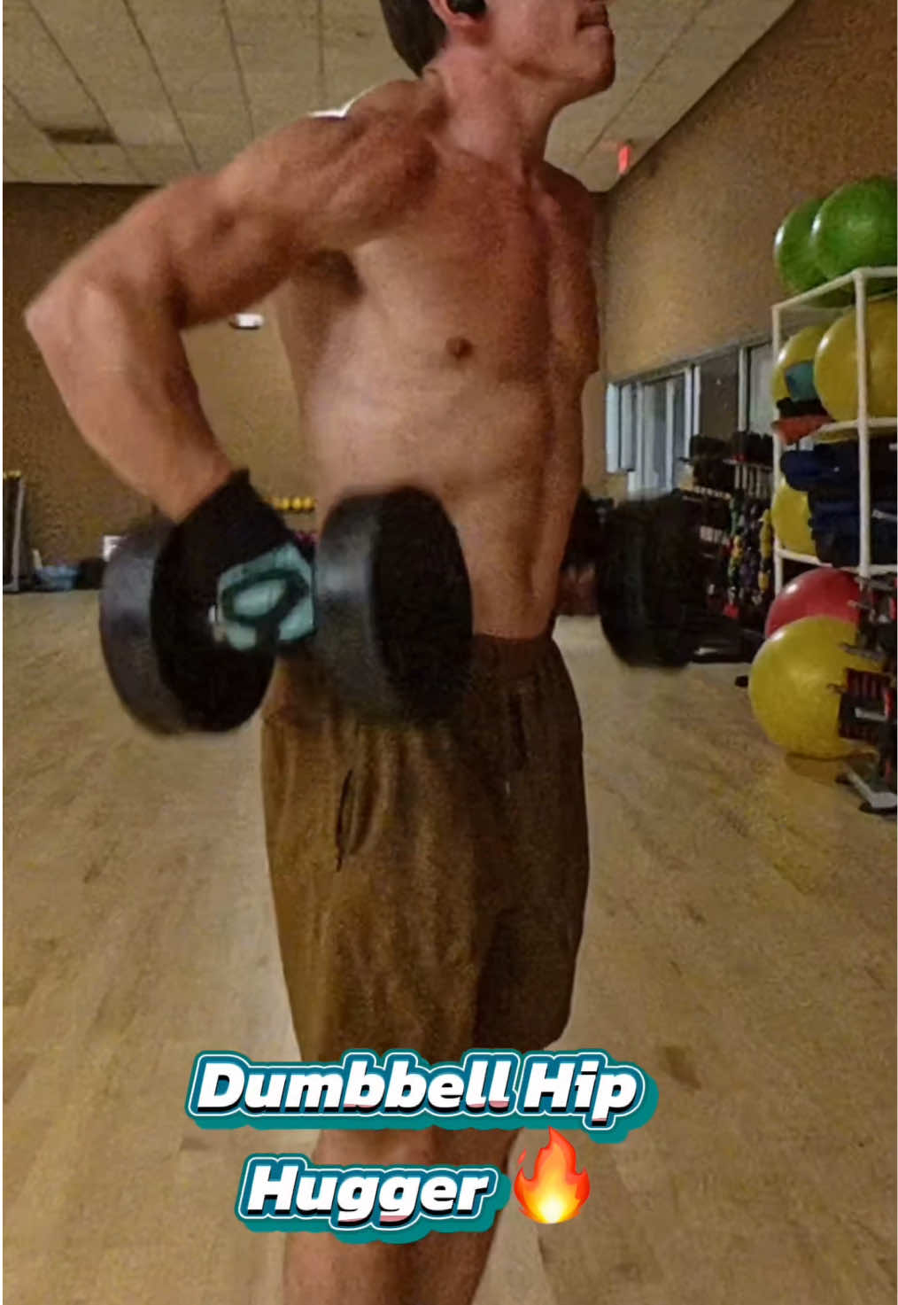 One of my favorite shoulder builders: The Dumbbell Hip Hugger. This exercise allows you to load heavier weight while isolating the middle and rear delts for maximum growth. 👉🏼Form Tips: 	•	Keep your hands close to your sides. 	•	Let your elbows drift out into abduction at the shoulders. 	•	Pull elbows slightly behind your torso to hit the rear delts. 	•	Raise dumbbells to about belly button height no higher to keep tension locked in. 👉🏼Rep/Set Protocol: 	•	Pick a weight that makes you fail at 12 reps (your ignition set). 	•	Rest 15 seconds, then continue with 20 effective reps at the same weight. 	•	Take 15-second breaks as needed between those reps to maintain form and control. This method builds delt size and strength by eliminating momentum and forcing strict activation of the target muscles. #ShoulderWorkout #DumbbellTraining #Delts #RearDelt #MiddleDelt          