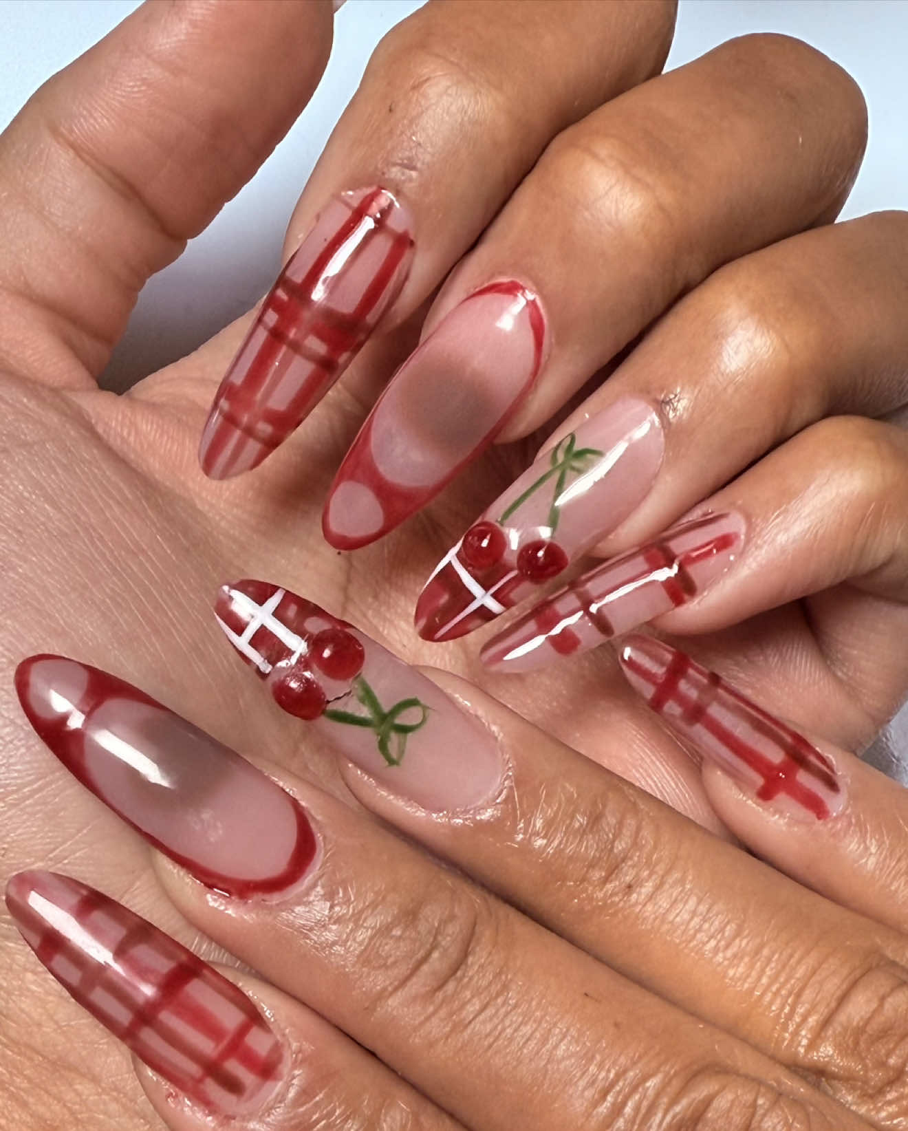 Did that !!! 🫣😝 💅 I love nail day , I can’t believe I thought myself how to do gelx nails at home . Super proud of this cherry and plaid design .  #nails #gelx #acrylics #nailday #diynails 
