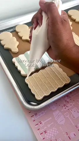 Dinosaur baby shower set! For the sage color I used a equal parts americolor wedgewood and ivory. Projector and edible pen linked on my amazon storefront. . . . #dinosaurcookies #dinosaurbabyshower #babyshowercookies #cookiedecorating #royalicing 