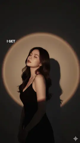 #CapCut #AI #เทรน์วันนี้ GEMINI➡️PROMPT Craft a moody studio portrait of the uploaded person, bathed in golden-orange spotlight that creates a glowing circular halo behind them on the wall. The warm light should sculpt the face and upper body with soft, sunset-like tones, while casting a strong head shadow to the right. Style the person. Her eyes are closed and chin tilted slightly up. #geminiai #photoshoot  