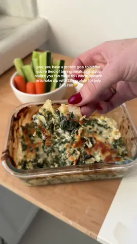 Who said hitting your goals had to be boring?! & yes this WHOLE thing is 28g protein and 245 calories!! Making it perfect for any fitness goal🥰 I’ve said it (more than) once and I’ll say it again: reaching your goals doesn’t have to suck!! Small swaps to your favorites go a long way RECIPE👇🏼 - finely dice 1/2 cup artichoke hearts (about half a can) & thaw, dice, and strain 1/2 cup frozen spinach (or wilt 1-2 cups fresh spinach on stove) - mix in a baking safe dish with 1/4 cup BLENDED lowfat cottage cheese (good culture if my fav), 1/4 cup 0% Greek yogurt (use a thick one like Fage), 1 tbsp Parmesan, 2 tbsp lowfat mozzarella, and salt, pepper, garlic powder to taste (about 1-2-1 tsp each) - top with another 2 tbsp lowfat mozzarella, and bake at 350°F for 20-25 until golden - serve!! Bonus: I cut up and bake carb balance tortillas for macro friendly chips here! Enjoy!! This recipe & hundreds more are included in my coaching for real results with foods you love🫶 join today and let’s make this a lifestyle!!🔗