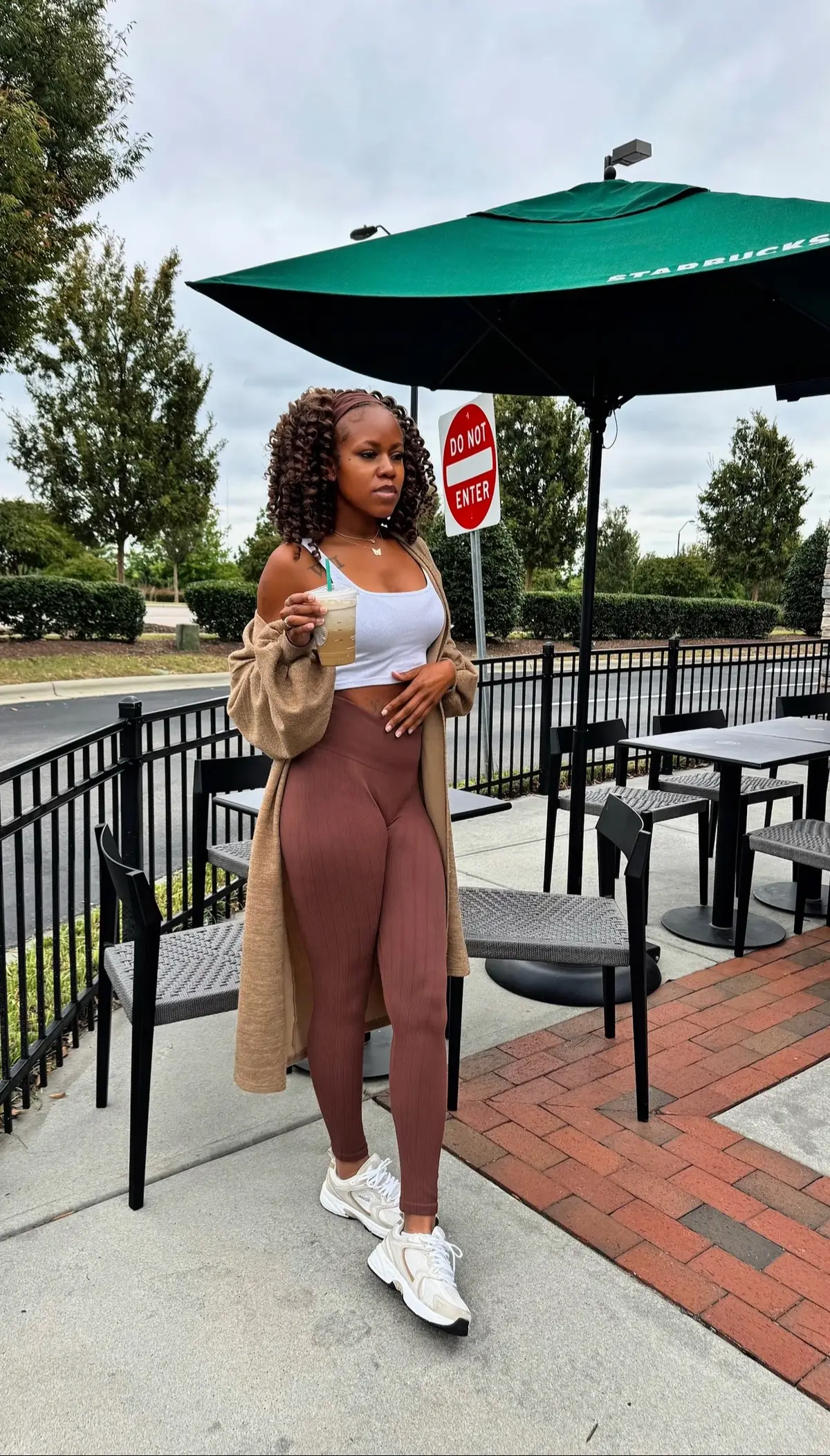 Serving fall vibes only 🍂✨ Cute outfit, cozy drink, and all the autumn feels. 