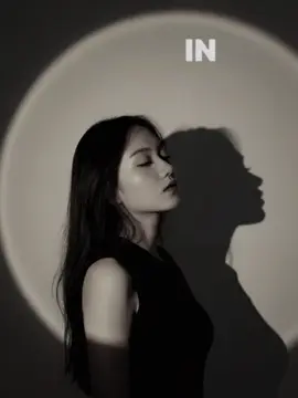 Gemini AI 🙈 craft a moody studio portrait of the uploaded photo, bathed in golden- orange spotlight, that creates a glowing circular halo behind them in the wall. The warm light should sculpt the face and the upper body with soft, sunset-like tones, while casting a strong shadow to the right. Style the person. Her eyes are closed and chin tilted slightly up. #gemini #AI #following 