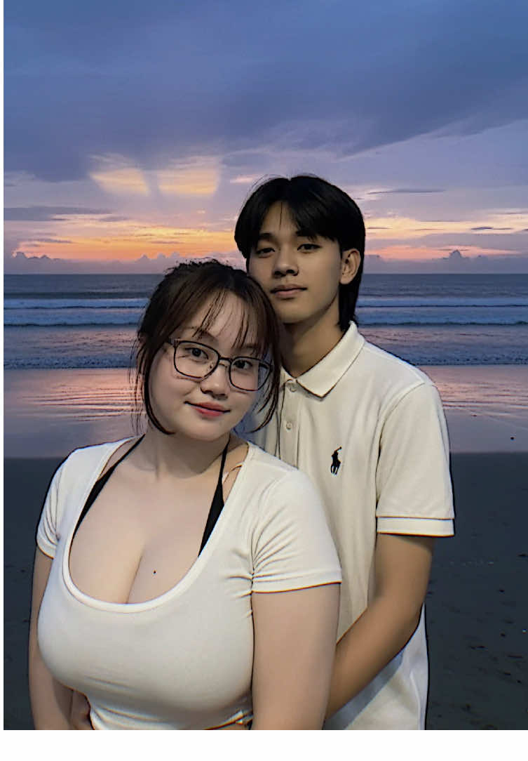 Hehe @Tokyo Vibess 😍 PROMPT👇 Jadikan kedua foto tersebut sebagai objek utama,jangan mengubah pakaian dan wajah asli pria dan wanita pada foto, yang di ambil menggunakan kamera iPhone terbaru dengan jarak yang dekat dengan resolusi tinggi,jangan ada efek bokeh atau blur,bayangan lembut,kontras tinggi,memiliki rasio vertikal 9:16 ,mereka berdiri menikmati pemandangan pantai saat waktu senja dengan pose romantis dan tersenyum tipis menatap ke arah kamera,di sebuah tepi pantai khas Indonesia pada waktu senja dengan langit biru tua yang dramatis yang dipenuhi awan tipis yang tersebar luas,beberapa cahaya menerobos dekat cakrawala, menghasilkan pantulan gradasi ungu-oranye di udara laut yang tenang pantai tersebut remang-remang oleh sisa senja, menciptakan suasana yang tenang dan damai. SELAMAT MENCOBA😍 #initokyolagii #pantai #googlegemini #ai #fyp 