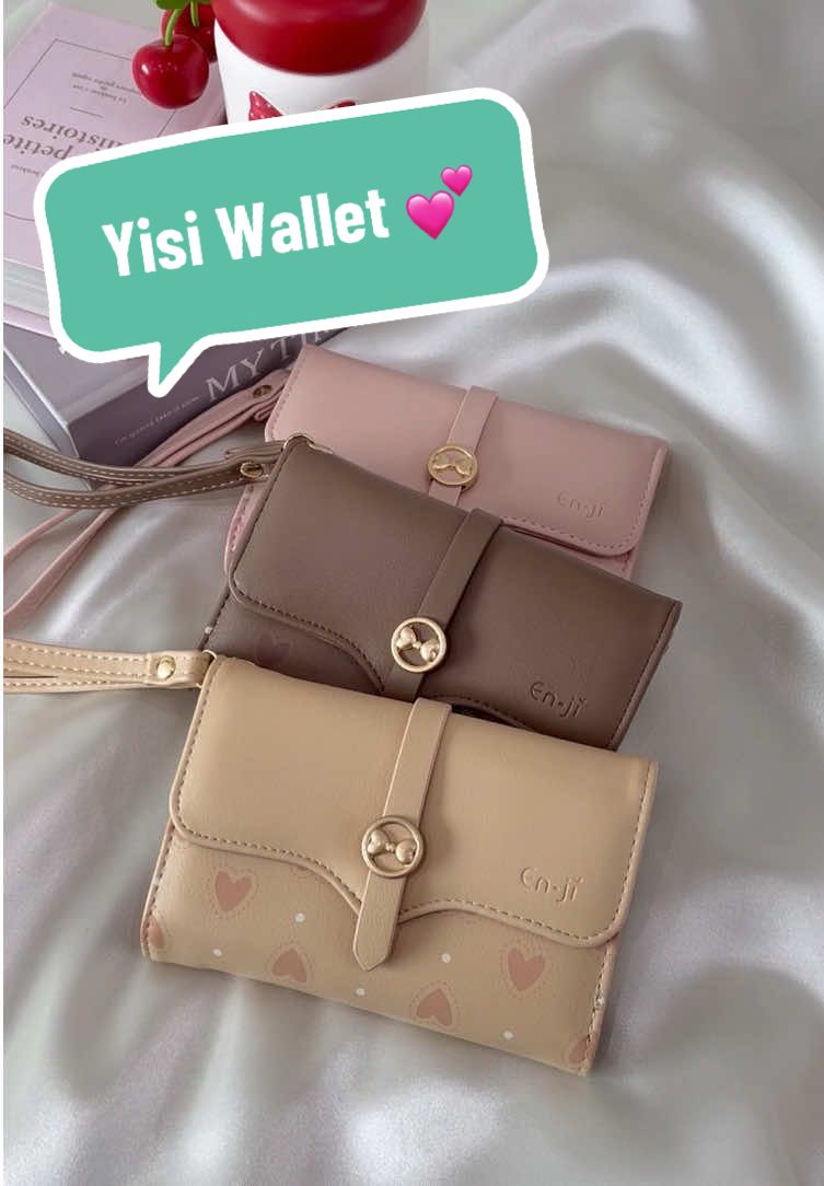 Bring a touch of romance with Yisi Wallet 💕 Her love print and ribbon charm make every look so cute so feminine. Styled with your Enji bag, she makes everyday feel like a love story. Available color : Nougat, Cream, Ballerinapink  #Enjiid #BanggaPakeEnji #Wallet #Handbag #TasWanita '
