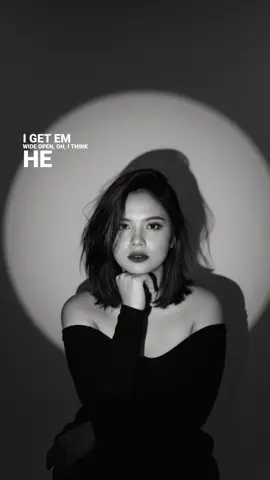 Prompt gemini AI :  Create a glamorous black and white portrait of a single lady, with slightly short messy hair, framing her smooth skin, wearing an off-shoulder top. Pose: sitting with one hand under her chin, looking at the camera with calm face wearing a red lipstick. Backdrop is a plain neutral wall illuminated by a round spotlight, casting a sharp, dramatic shadow behind me for cinematic affect.  #trendingtiktok   #geminiai  #prompt  #fyp   #masukberanda 