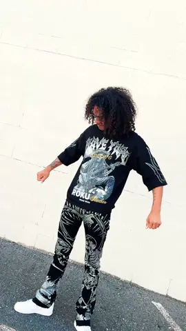 Men’s streetwear fit that speaks for itself – graphic shirt paired with statement jeans. Built for style, built for the streets. 👕👖 #mensstreetstyle #mensjeans #mensshirt #streetwear 