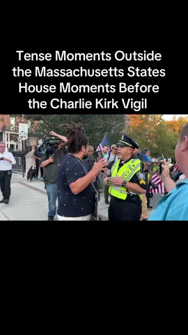 Tonight thousands gathered to remember the life of Charlie Kirk- moments before police escorted this man away
