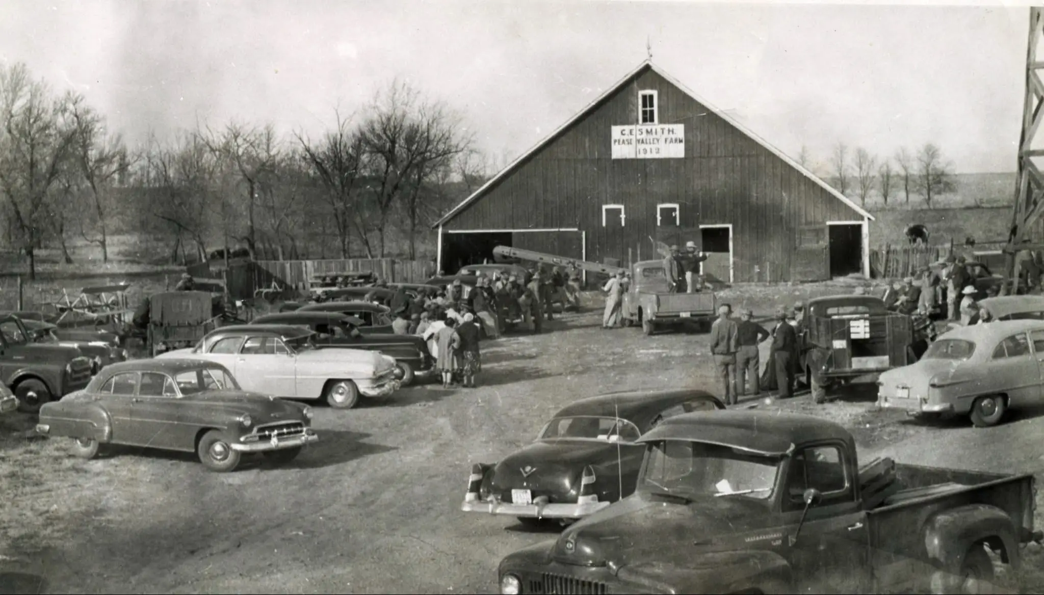 Someone was thinking ahead and took this photo in 1953 on the day that my great grandpa's farm was sold. Charlie Smith's sign from his barn that you can see in this photo still exists on the site of his farm in a modern barn at Geddes, South Dakota.   #genealogy