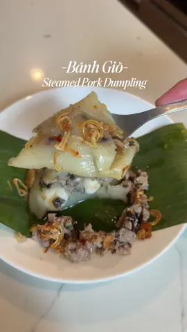 Making one of my FAVE vietnamese food; Bánh Giò aka Steamed Pork Dumpling!!  Recipe makes around 10 dumplings  Flour mix: 1 packet of premade bánh giò Flour  1 box of chicken broth  2 tbsp of olive oil  Mix until everything is dissolved  Cook on LOW heat until it looks likes like a paste  Pork filling:  -1lb Pork -Green onion -white onion -Woodward mushroom -shallots -fish sauce -sugar -chicken bouillon  -black pepper -msg (optional)  -Fried shallots  Stir fry until cooked through. Season and adjust to your taste    Additional:  Quail eggs  Nuoc Cham sauce  Fried Shallots  Blanch your banana leaves in boiling water for 10-15 seconds. Shape into a cone.  Add flour paste, pork mixture, and 2 quail eggs into your cone.  Steam on med high heat for 15-18 mins. Once it’s done, let it sit for 10 mins to cook before eating. I like to dress mine with extra fried shallots & Nuoc Cham sauce.    #fyp #banhgio #cooking #vietnamesefood #viral 