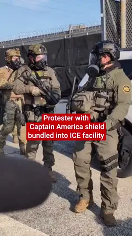 This is the moment that an ICE protester wielding a Captain America shield was forced into an immigration facility after he threw a tear gas canister at enforcement agents. Footage shared on Friday (19 September) shows the individual, who is wearing a jacket with USA written on the sleeves, throwing the canister at ICE officers, who immediately swarm him and drag him inside the Illinois facility. Protesters have been staging frequent demonstrations outside the building ever since the Trump administration suggested it would be ramping up ICE operations in Chicago, dubbed “Operation Midway Blitz”. The Department of Homeland Security said the operation will 