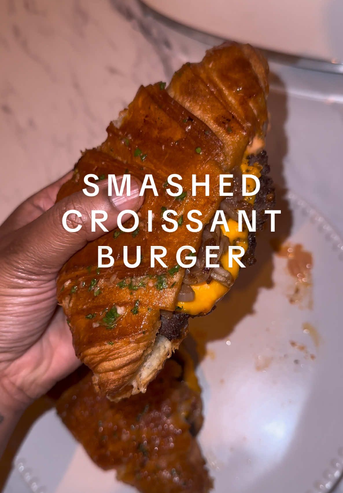 Been dying to try this smashed croissant burger and omg 🤤🤤🤤  Recipe: minced beef formed into patties, seasoned with black pepper, salt and all purpose (1 tsp each). Onions: 1 large yellow onion, cook on low until softened and then add 1 tbsp Worcester sauce and 1 tbsp balsamic vinegar. Sauce: 2 tbsp ketchup, 1 tbsp mayo, 1 tbsp mustard, 1 tbsp pickle juice, chopped pickles. Croissant glaze: melted butter, 1 tbsp minced garlic, 1 tbsp parsley, 1 tsp smoked paprika 🫶🏾   #cooking #food #fypシ゚ #FoodTok #EasyRecipes 