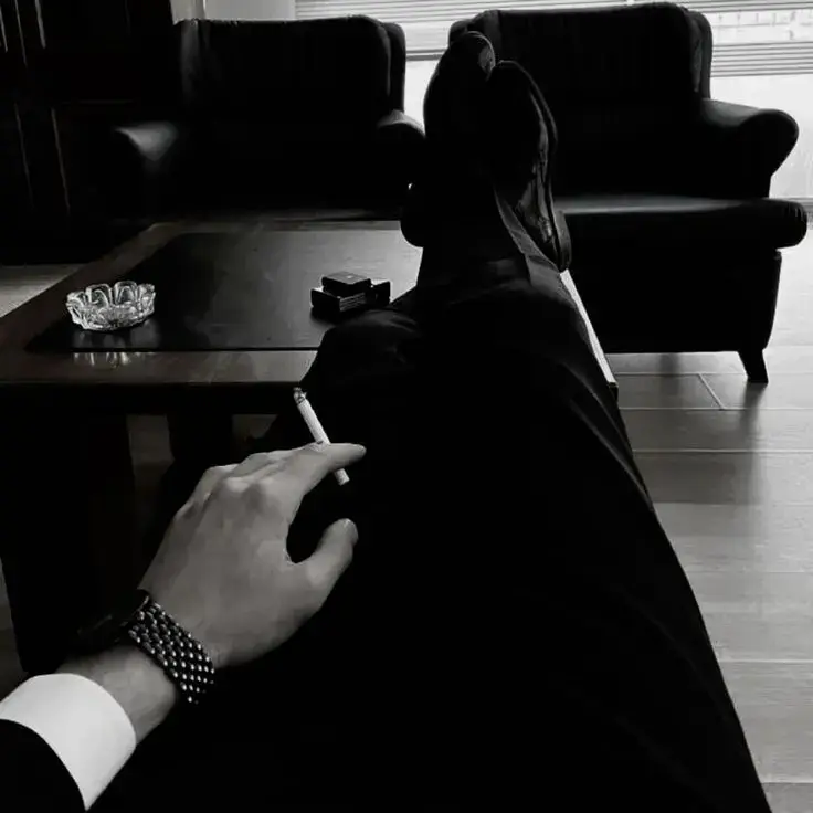 Baskara. He’s your husband. A man who rarely shows his emotions—unless it concerns you.  Tonight, he’s been working late at his office. You’ve gone out with your friends, without asking. You know he wouldn’t let you… so you don’t tell him. When he finishes his work and comes to the room, you’re not there. He tries calling, but you don’t answer.  When you finally get home, he’s waiting on the couch—his eyes sharp, his jaw clenched. The room feels colder.  You barely get a word out before he stands up and walks toward you.  He doesn’t scream. He just grabs your wrist gently, leans in closer, and says in a low, warning voice:  “So this is what you do when I’m busy?” “You’re mine. Next time, just ask. Or I’ll make you regret not doing so.” You can’t tell if it’s anger… or jealousy. Maybe both. But deep down, you know — no one else will love you like this.  but suddenly he picks you up. not waiting for your response he carries you to the bedroom. ignoring your resistance or protests. 