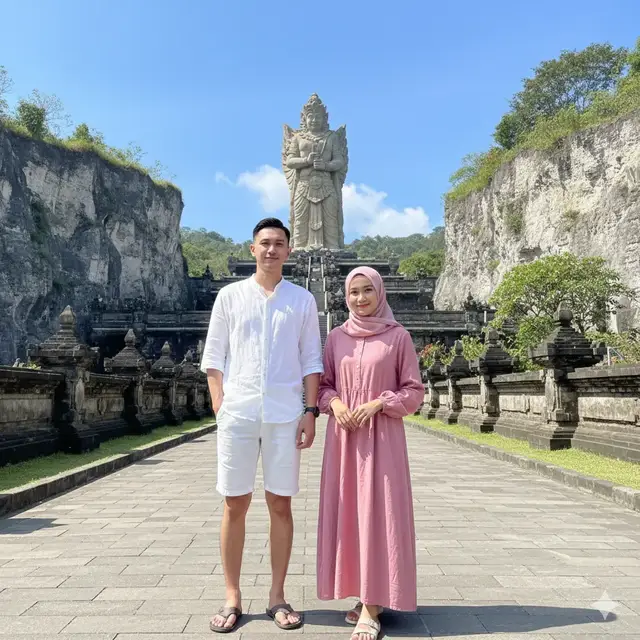 Foto realistik full body dengan rasio 9:16. Latar belakang patung Garuda Wisnu Kencana (GWK) Bali terlihat jelas dan megah, langit biru cerah. Kanan kiri ada tebing batu kapur tinggi dengan tanaman hijau, jalan setapak batu di bawah. Model: Pria Indonesia:  Outfit: kemeja kasual putih tipis, celana pendek putih, sandal santai. Wanita Indonesia:  Outfit: dress kasual pink longgar, hijab pink senada, sandal santai. Pose & Ekspresi: Pria dan wanita berdiri berdampingan di jalan setapak, saling berpegangan tangan. Salah satu menoleh ke pasangannya, satunya lagi menatap kamera. Ekspresi senyum tipis tanpa gigi. Komposisi full body, tubuh proporsional realistis. #gwkbali #aiphoto #photocouple #nasyirwan #prewedding 