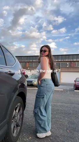 What’s the rule of 7? It’s a styling tip where each piece of clothing is assigned a number. Basic clothing is assigned 1 point (for example, my top and shoes) and anything that is a statement piece, textured, or patterned is a 2 (the bow jeans). Your goal is to add points of interest like accessories until your outfit is between a 7-10 for a balanced but not too basic look (10+ and you’re a maximalist queen, go off). How do you think I did? #stylingtips #midsizestyle 