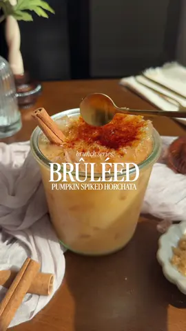 Fall brunch vibes only 🍁🍂 If you haven't tried spiked horchata yet WHAT ARE YOU WAITING FOR?! But fr, add a cracking brûléed top to it & thank me later. Brûléed Pumpkin Spiked Horchata You'll Need: 2 spoonfuls of pumpkin purée 1.5 oz vanilla vodka 3 oz horchata Dash of pumpkin pie spice 2 spoonfuls of turbinado sugar 1/2 an orange Bar torch Cinnamon stick In a shaker, combine vodka, horchata, pumpkin purée, and pumpkin pie spice. Shake with ice for 8 seconds and strain over fresh ice. On an orange half, pour turbinado sugar and use the back of your spoon to spread it around. VERY CAREFULLY torch the sugar. Using tongs, remove and place atop your cocktail. Add a cinnamon stick and crack into it. PSA: be careful when torching your orange, it can get very hot! #brunch #horchata #brulee 
