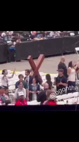 Man carrying a cross at Charlie’s memorial 🥹🥹#memorial #charlie #charliesmemorial 