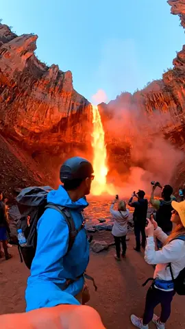 🔥 An explorer has a GoPro and hikes along the edge of the canyon. At first, a powerful waterfall crashes down the cliffs — but mid-fall, the water suddenly transforms into glowing molten lava. Steam rises, rocks crack, and tourists gasp in disbelief as the molten flow lights up the canyon. The shaky, first-person POV makes it feel like you’re right there, standing at the edge of the impossible. Would you dare get this close? #EarthImpacts #AIArt #AIgenerated #GenerativeAI #OpenAI                   