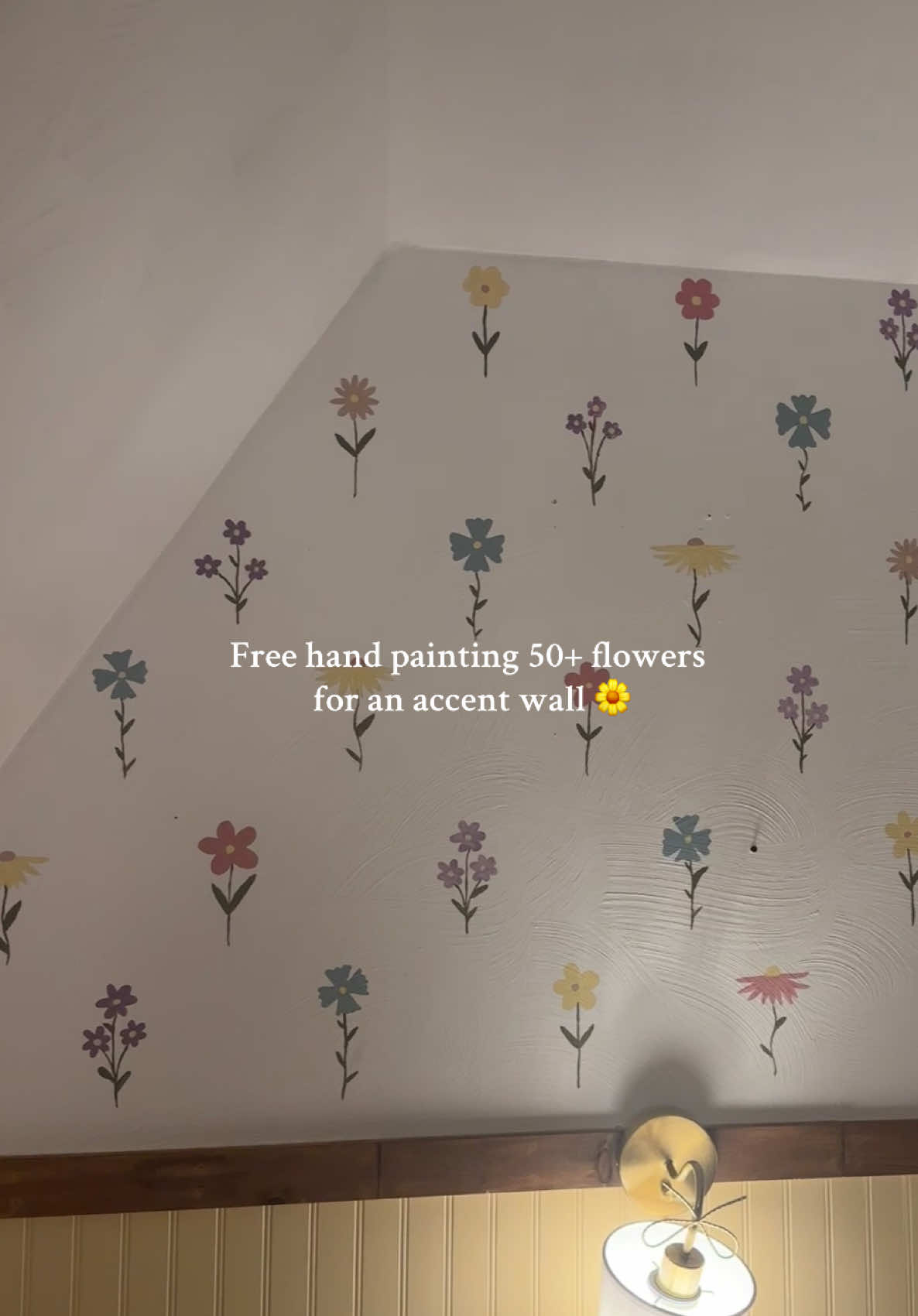 Hand painted accent wall in the making 🌻🌷🌸  We have textured walls, so our options were limited. We tried wallpaper, and it didn’t work out. Neither did sticky decals. And the stencils were a big fat no with our textured walls too. So I decided to hand paint an accent wall to mimic wallpaper.  #nursery #nurserydecor #accentwall #wallpaper #wallpainting 